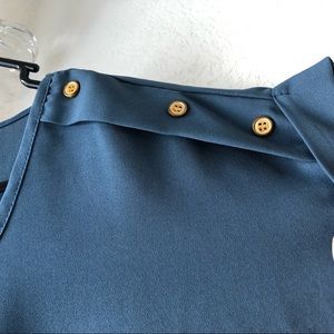 Blue top with gold button detailing